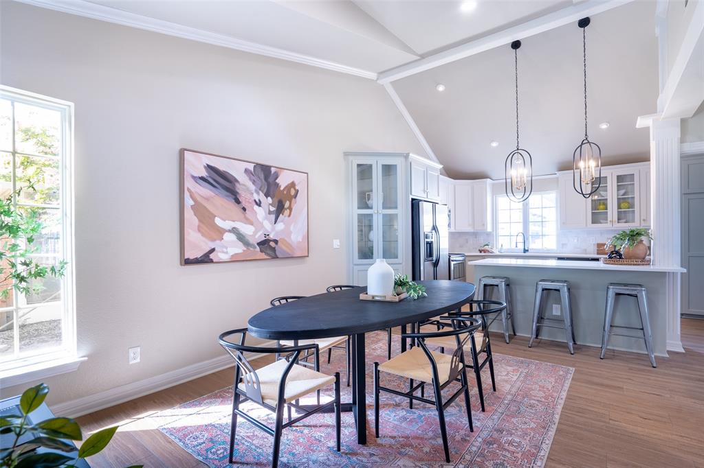 1415 Pecos Street Dallas, TX 75204 - Photo 11 of 25 a view of a dining room with furniture window and wooden floor
