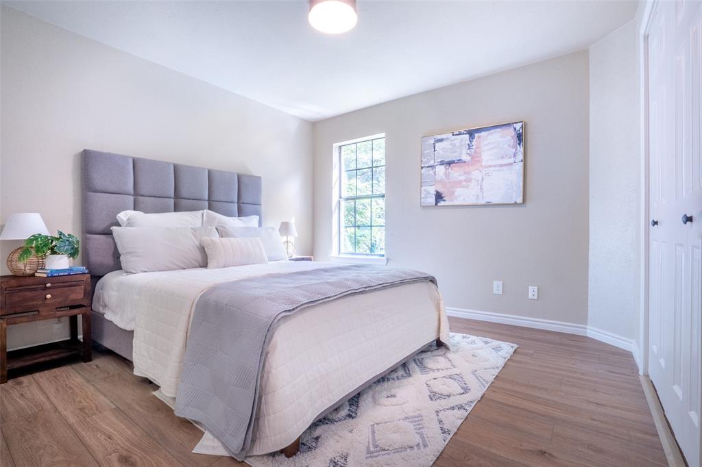 1415 Pecos Street Dallas, TX 75204 - Photo 13 of 25 a bedroom with a bed and a window