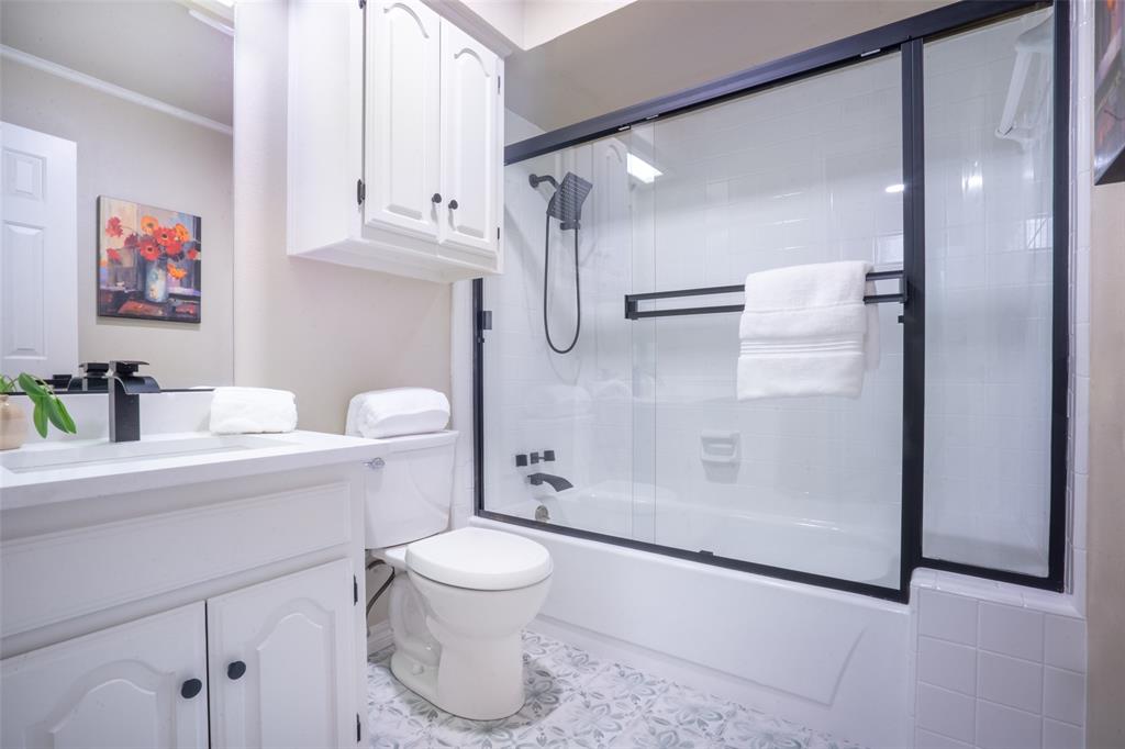 1415 Pecos Street Dallas, TX 75204 - Photo 14 of 25 a bathroom with a shower a toilet and a sink