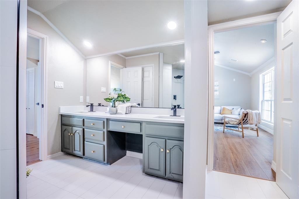 1415 Pecos Street Dallas, TX 75204 - Photo 17 of 25 a spacious bathroom with a sink double vanity and a mirror