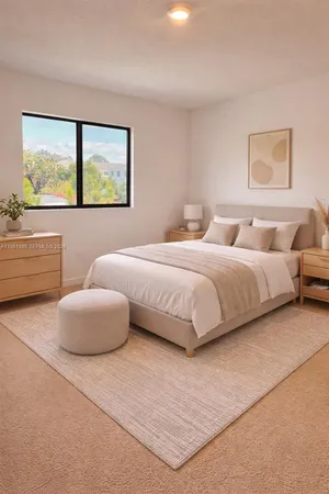 a bedroom with a bed and a couch