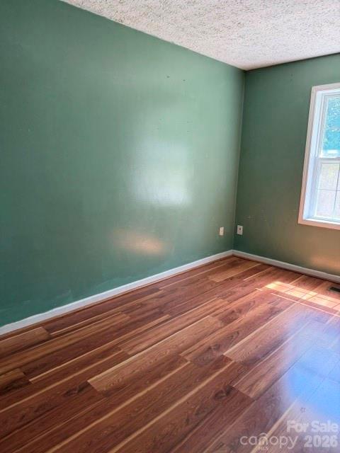 4084 Carpenters Cove Road Claremont, NC 28610 - Photo 22 of 27 a view of a room with wooden floor and fan