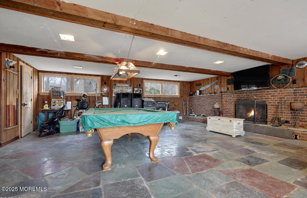 207 Lakeside Avenue Colts Neck, NJ 07722 - Photo 15 of 17 a room with lots of furniture and a fireplace