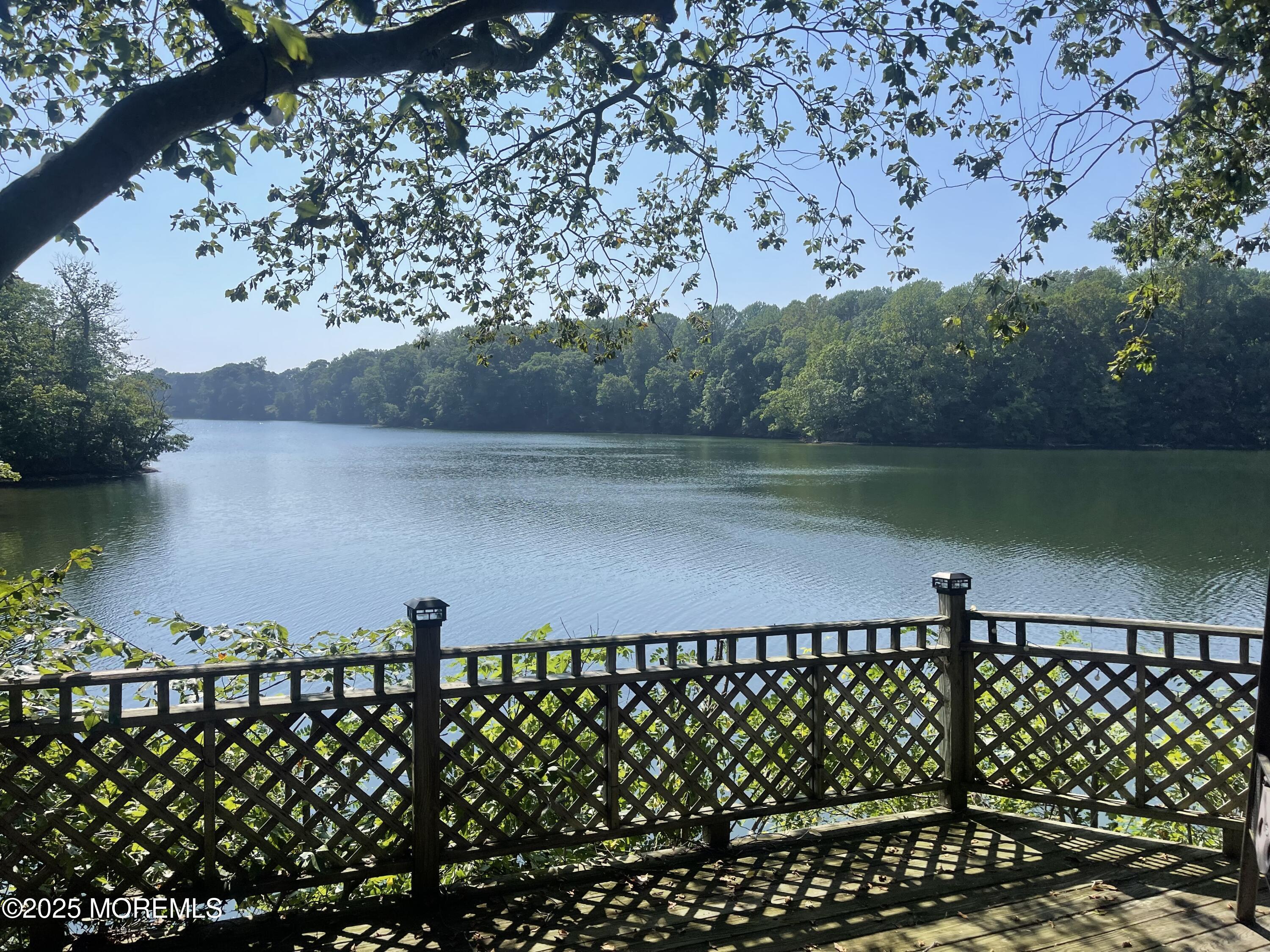 207 Lakeside Avenue Colts Neck, NJ 07722 - Photo 2 of 17 a view of a lake from a balcony
