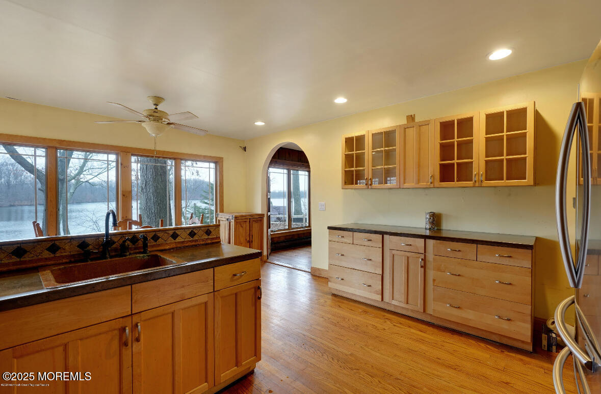 207 Lakeside Avenue Colts Neck, NJ 07722 - Photo 10 of 17 a large kitchen with kitchen island granite countertop a large window and stainless steel appliances