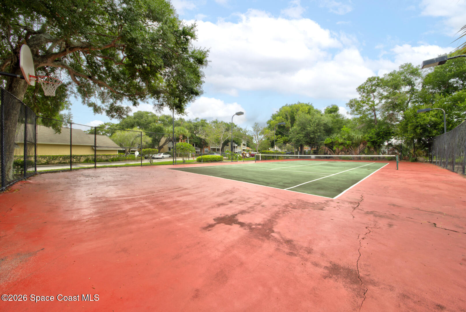 225 South Tropical Trail, Unit 605 Merritt Island, FL 32952 - Photo 29 of 36 Sunset Bay tennis & basketball courts