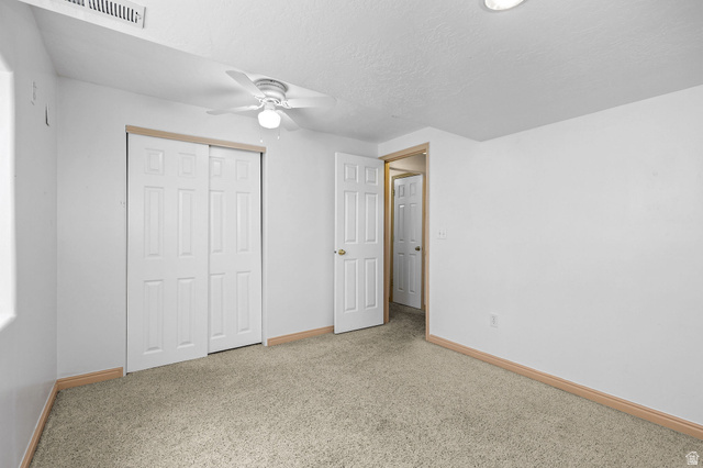 142 East 2675th Street South Clearfield, UT 84015 - Photo 29 of 49 Carpeted room with white walls and a ceiling fan