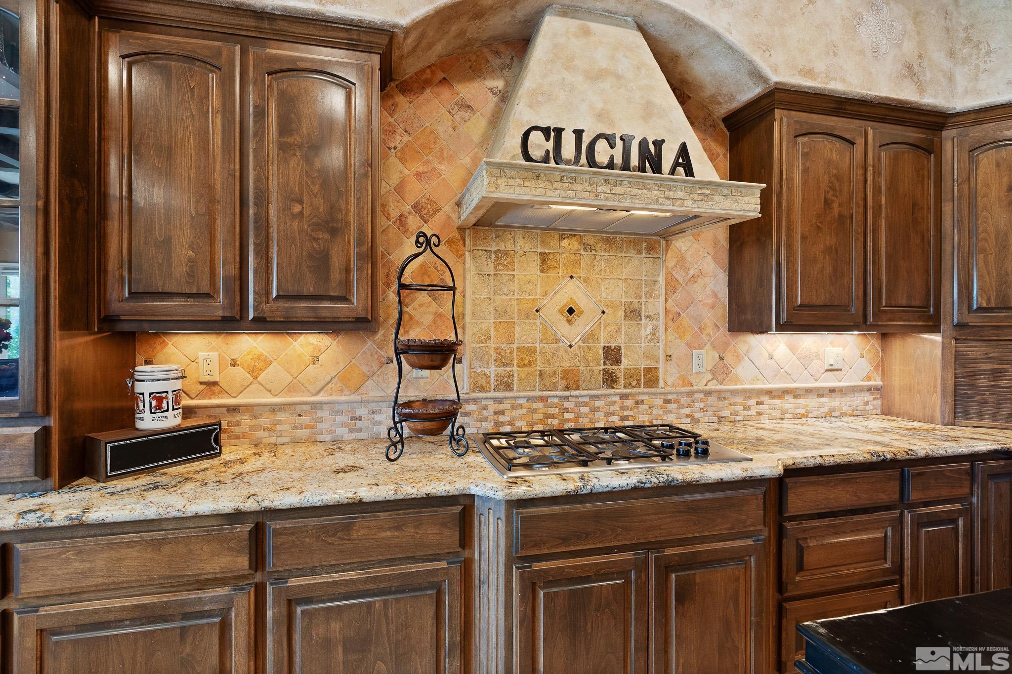 4885 Mountainshyre Road Reno, NV 89519 - Photo 12 of 39 a kitchen with granite countertop a stove and cabinets
