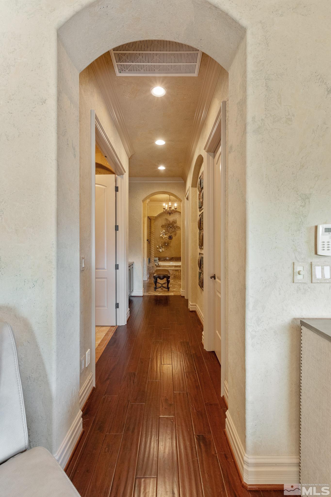 4885 Mountainshyre Road Reno, NV 89519 - Photo 19 of 39 a view of a hallway with wooden floor and furniture