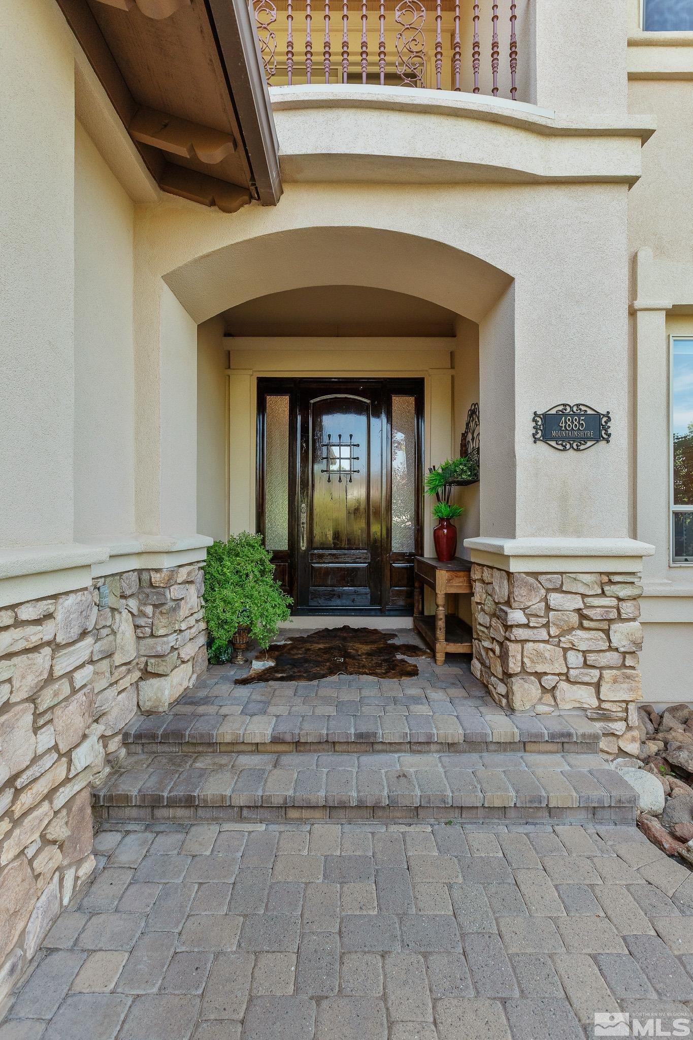 4885 Mountainshyre Road Reno, NV 89519 - Photo 2 of 39 a front view of a house with a yard