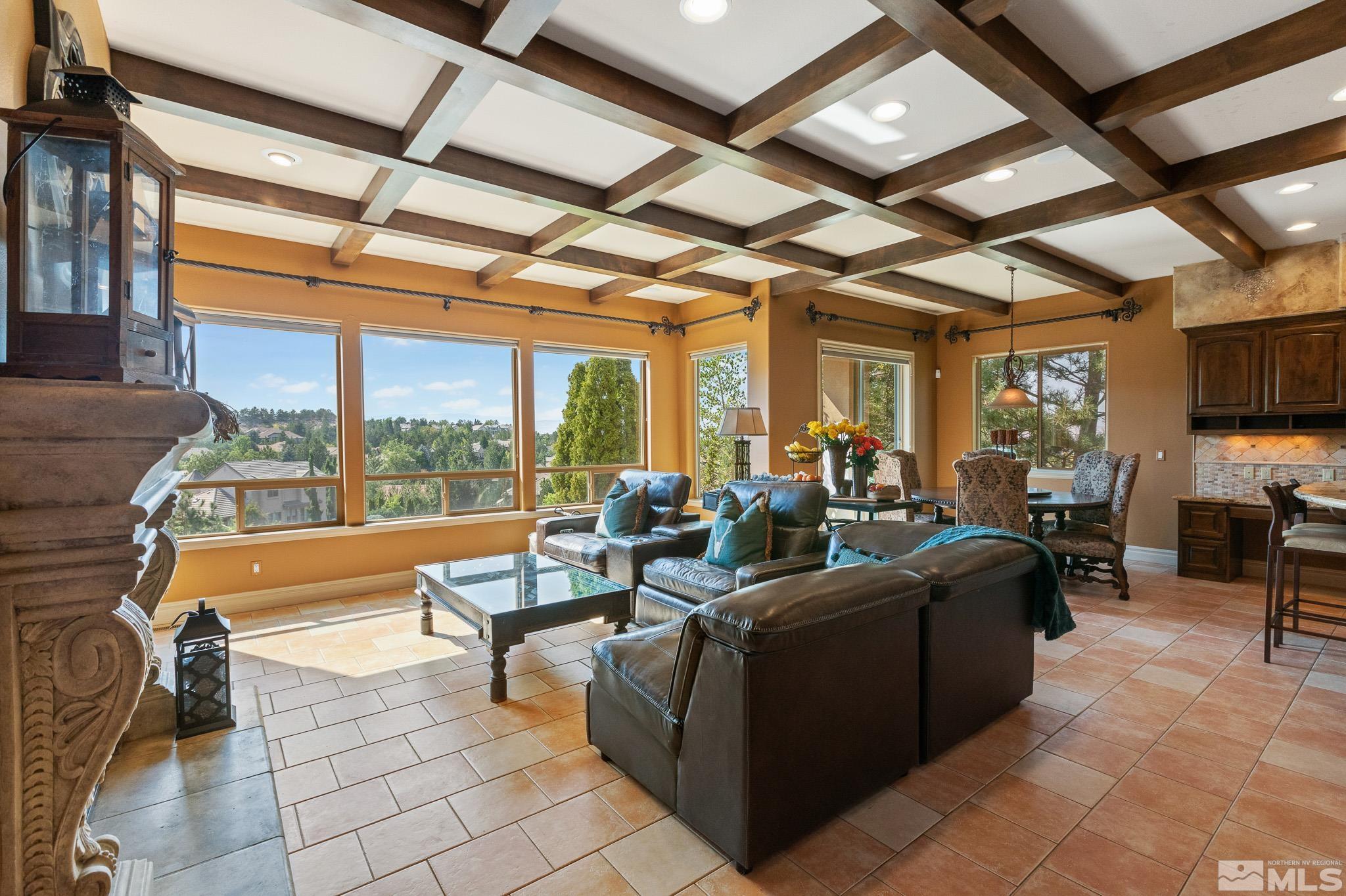 4885 Mountainshyre Road Reno, NV 89519 - Photo 7 of 39 a living room with patio furniture and a floor to ceiling window