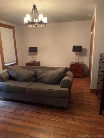 a view of a livingroom with wooden floor