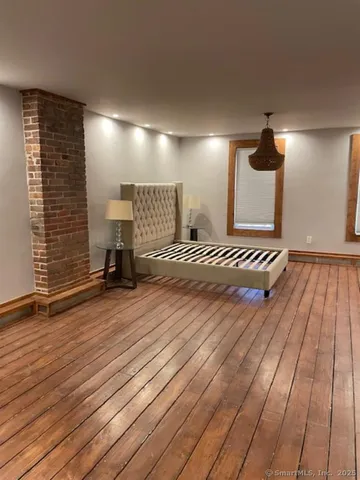 a bathroom with a toilet a sink and a mirror