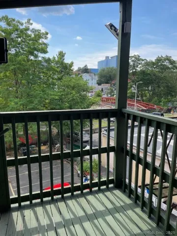 a view of a car parked on the side of the road