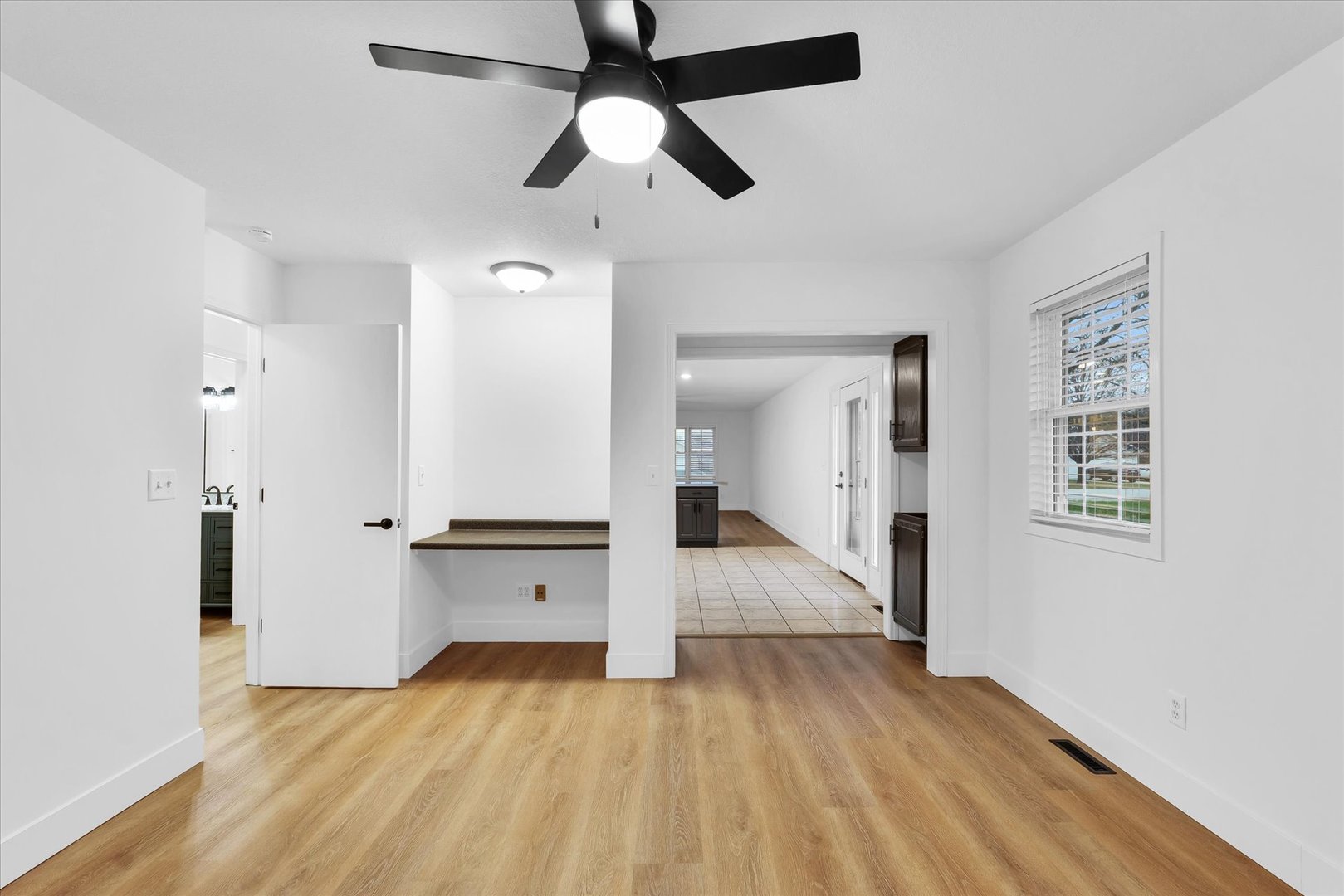 203 West Main Street Ogden, IL 61859 - Photo 13 of 27 wooden floor in an empty room with a window