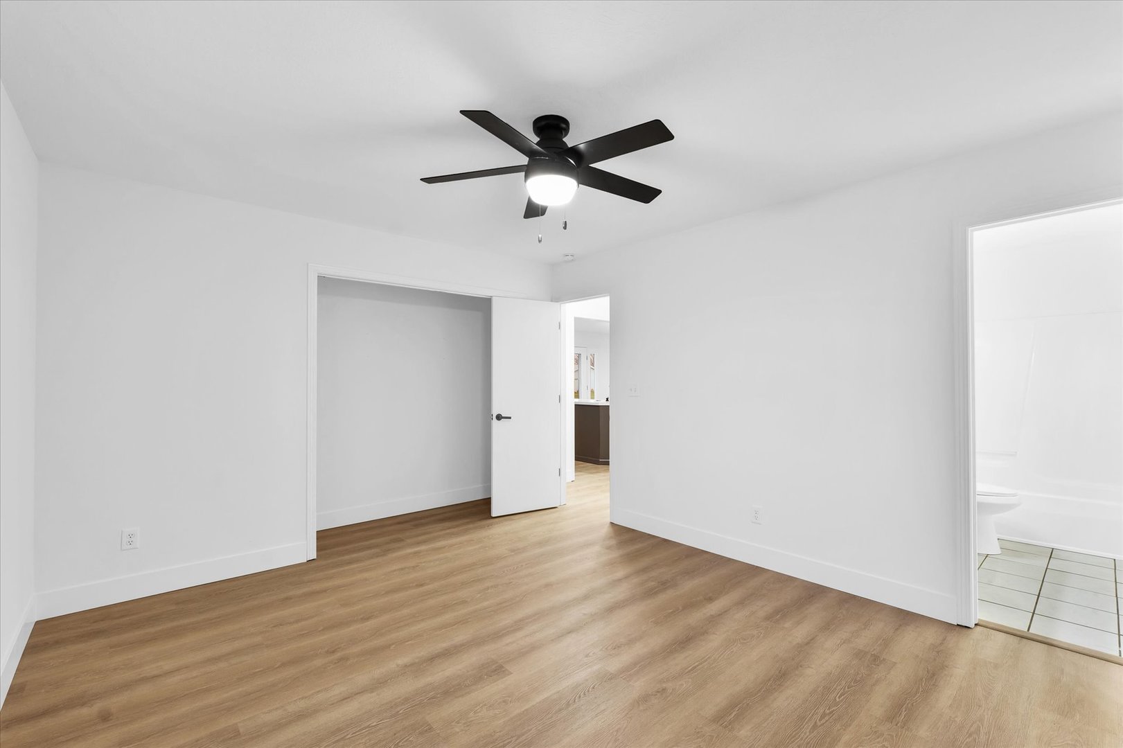 203 West Main Street Ogden, IL 61859 - Photo 15 of 27 a view of an empty room with wooden floor