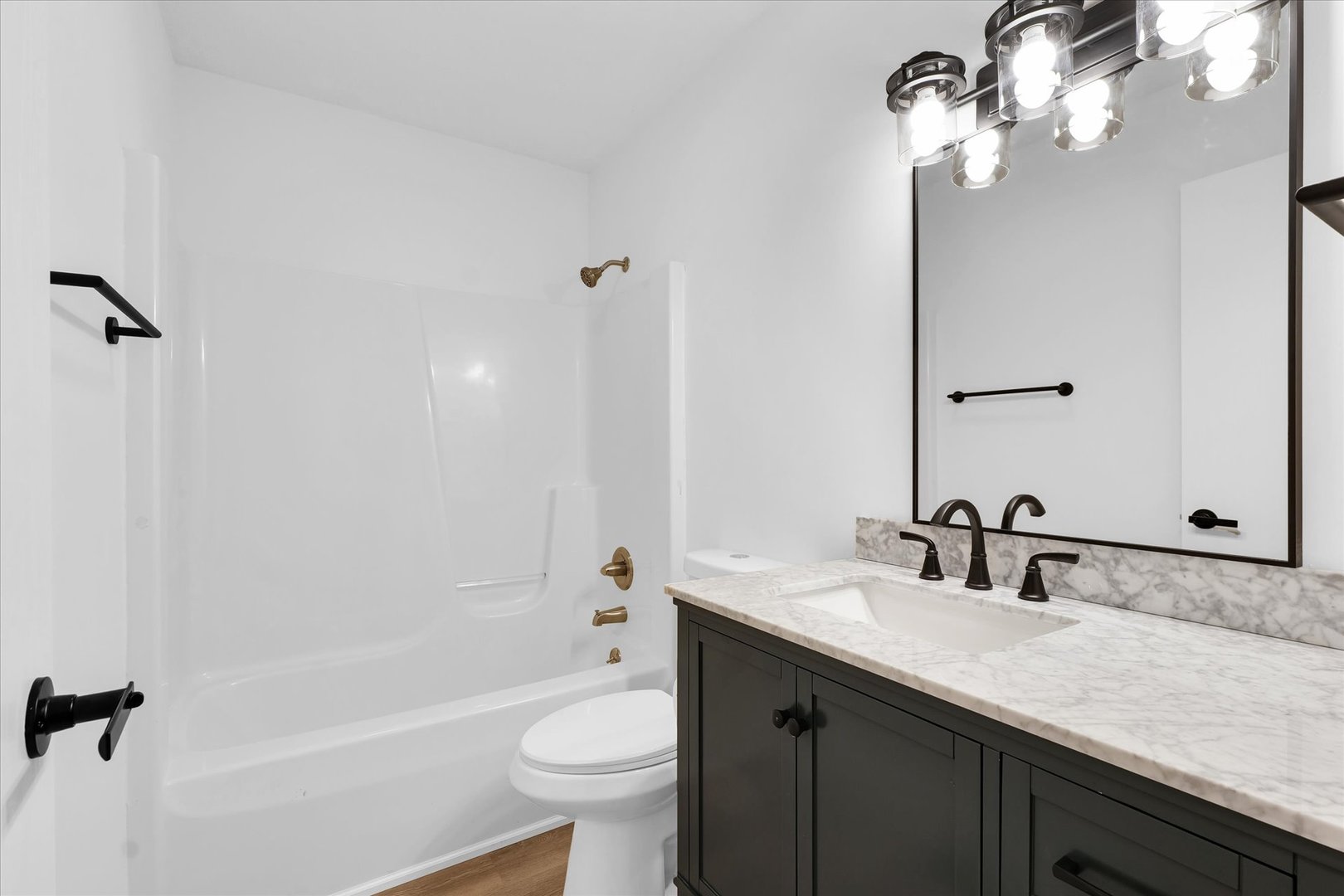 203 West Main Street Ogden, IL 61859 - Photo 20 of 27 a bathroom with a sink a toilet and shower