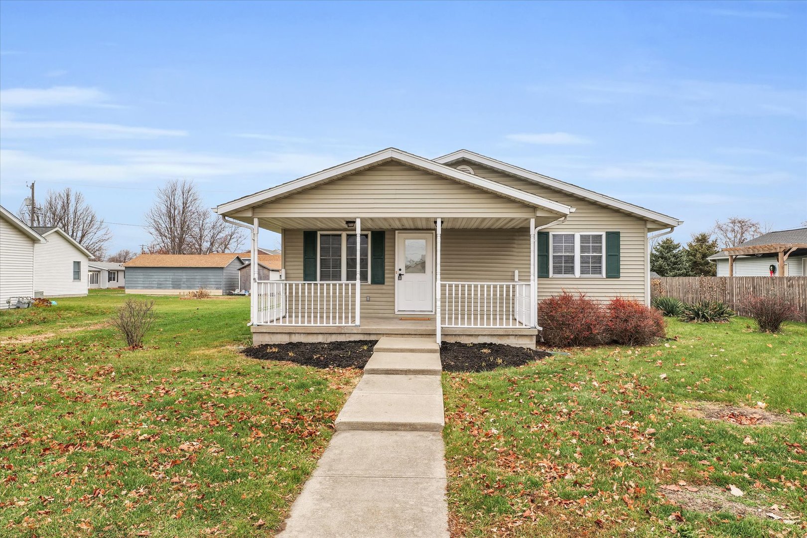 203 West Main Street Ogden, IL 61859 - Photo 2 of 27 a front view of a house with garden