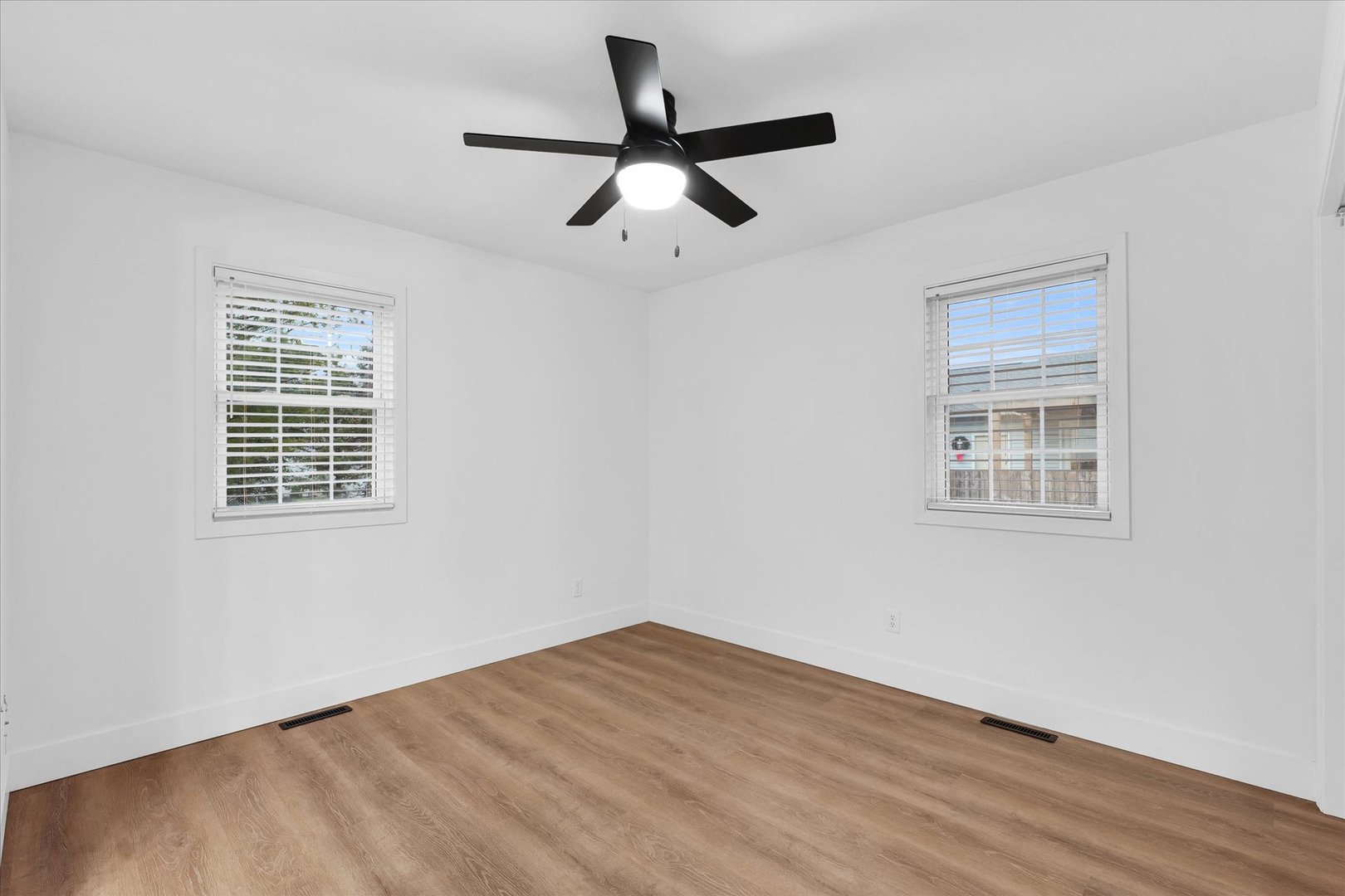 203 West Main Street Ogden, IL 61859 - Photo 21 of 27 a view of empty room with wooden floor and ceiling fan