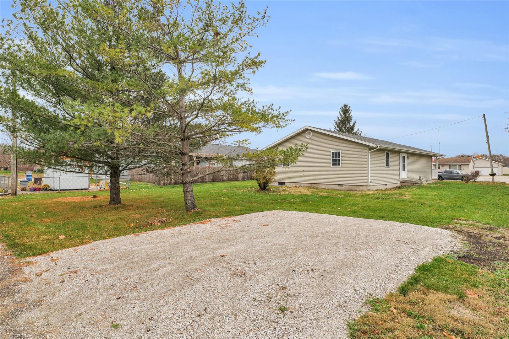 203 West Main Street Ogden, IL 61859 - Photo 24 of 27 a view of dirt house with a big yard and large trees