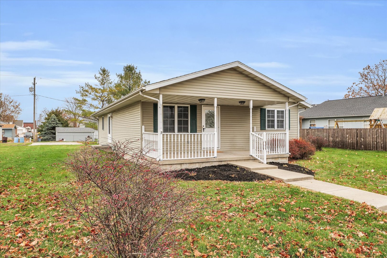 203 West Main Street Ogden, IL 61859 - Photo 3 of 27 a front view of a house with garden
