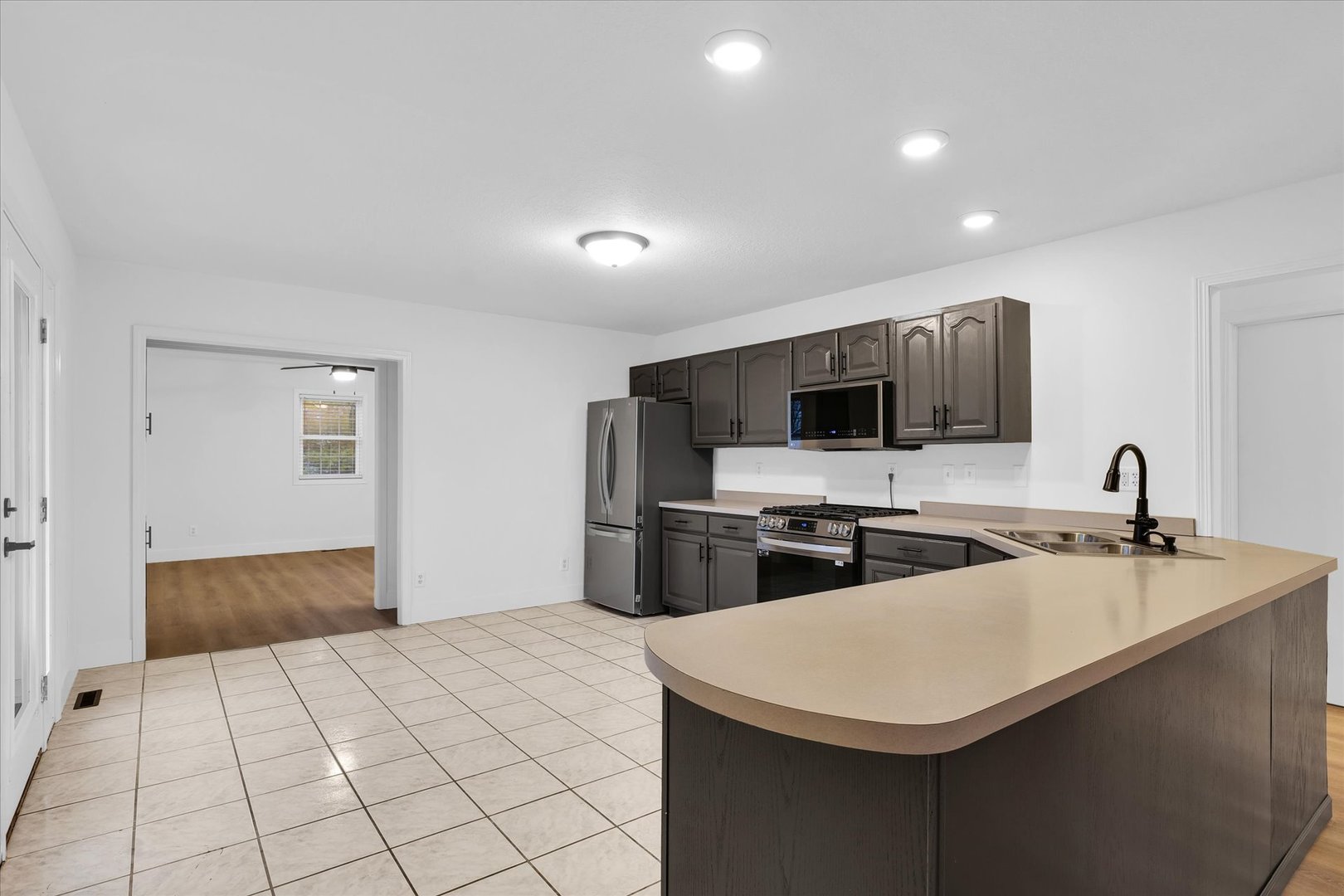 203 West Main Street Ogden, IL 61859 - Photo 9 of 27 a kitchen with stainless steel appliances a sink stove and refrigerator