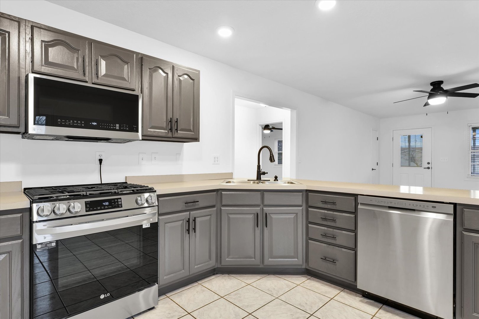 203 West Main Street Ogden, IL 61859 - Photo 10 of 27 a kitchen with cabinets stainless steel appliances and a sink