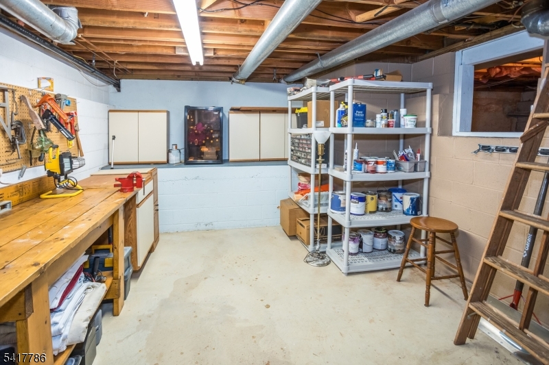 10 Torlish Gate Raritan, NJ 08869 - Photo 29 of 40 a utility room with fridge and a wooden floors