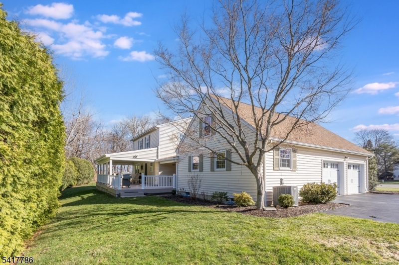 10 Torlish Gate Raritan, NJ 08869 - Photo 34 of 40 a house view with a sitting space and garden