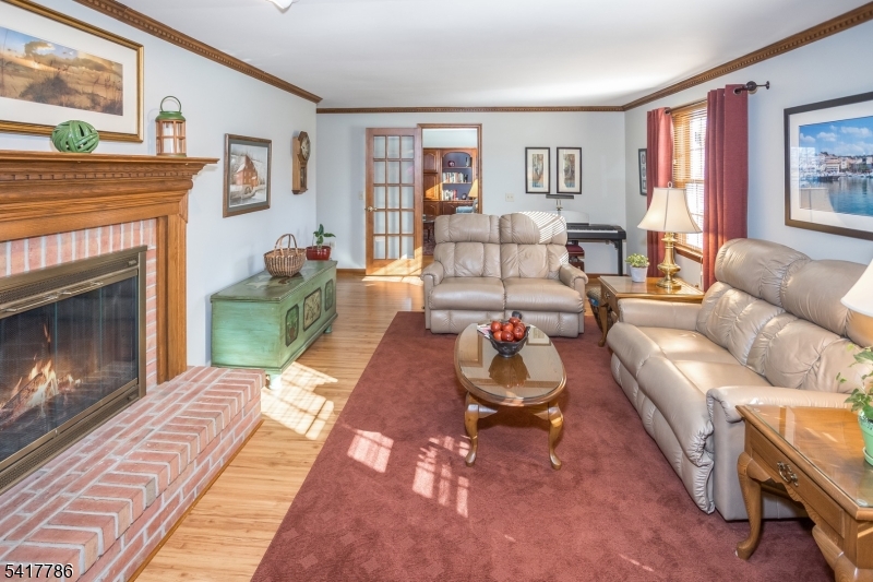 10 Torlish Gate Raritan, NJ 08869 - Photo 5 of 40 a living room with furniture and a fireplace