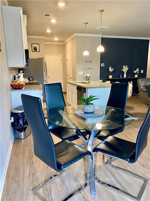 5149 Fox Den Road Oakwood, GA 30566 - Photo 17 of 44 a workspace with furniture and wooden floor