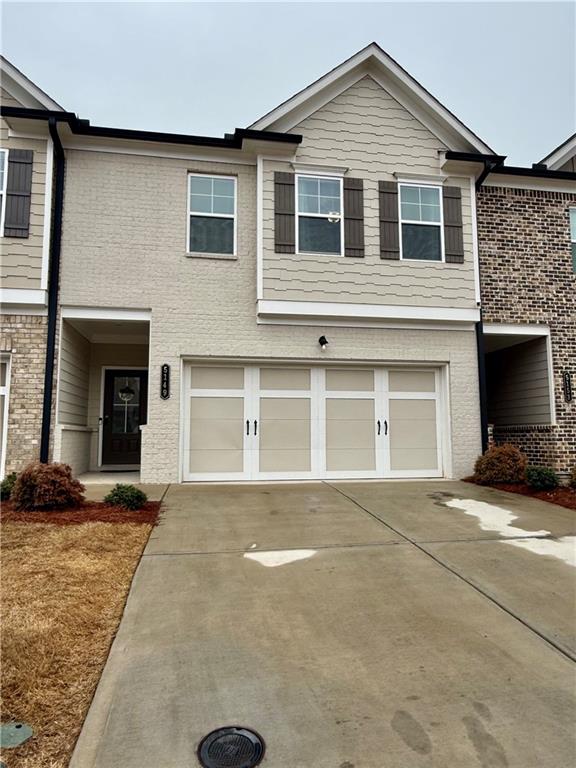 5149 Fox Den Road Oakwood, GA 30566 - Photo 2 of 44 a front view of a house with a yard and parking space