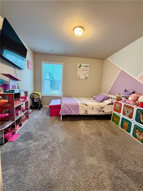 5149 Fox Den Road Oakwood, GA 30566 - Photo 23 of 44 a bedroom with a bed and a tv