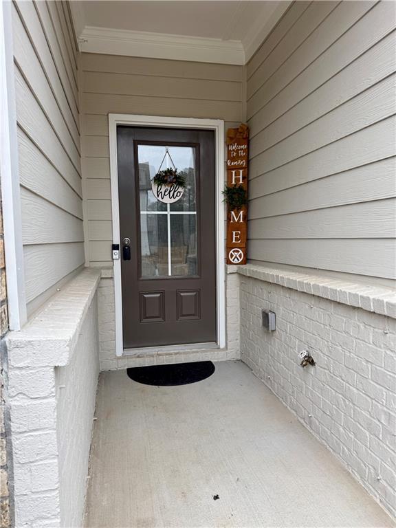 5149 Fox Den Road Oakwood, GA 30566 - Photo 3 of 44 a view of front door and porch