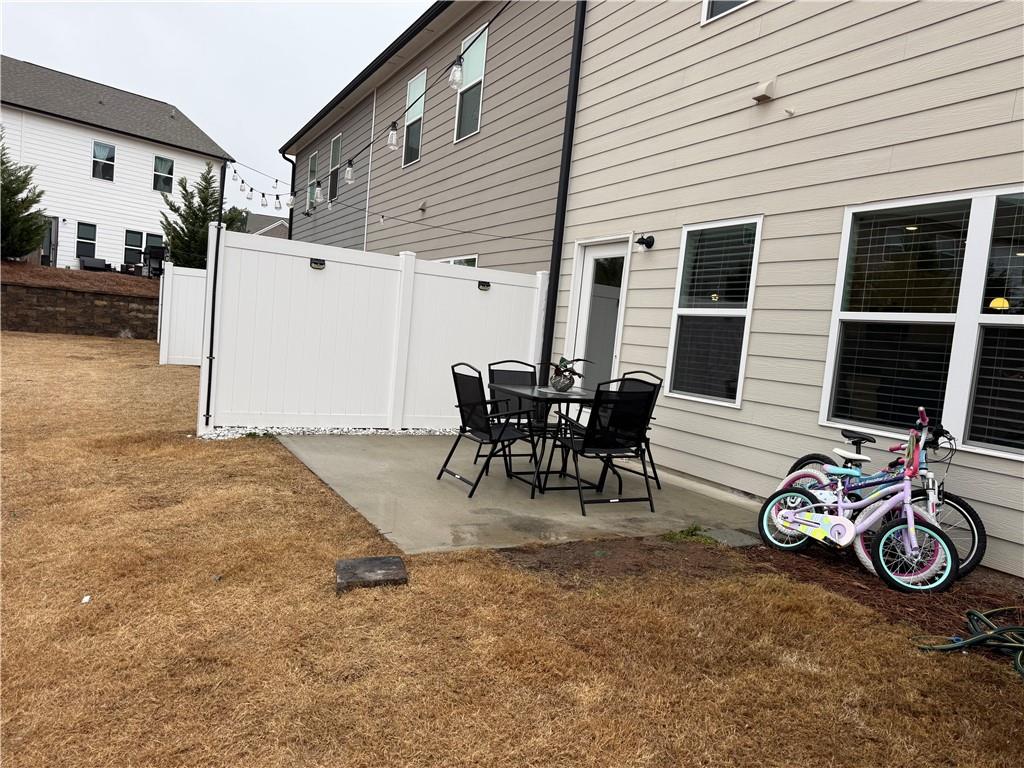 5149 Fox Den Road Oakwood, GA 30566 - Photo 39 of 44 a view of a patio with table and chairs