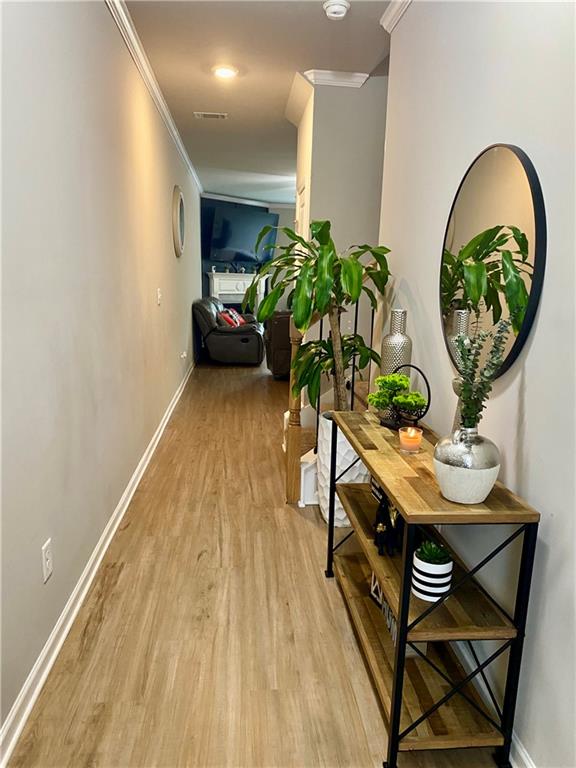 5149 Fox Den Road Oakwood, GA 30566 - Photo 4 of 44 a living room with furniture and a potted plant
