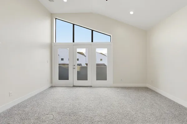 an empty room with windows and closet