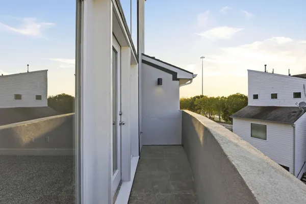 a balcony with view of nearby houses