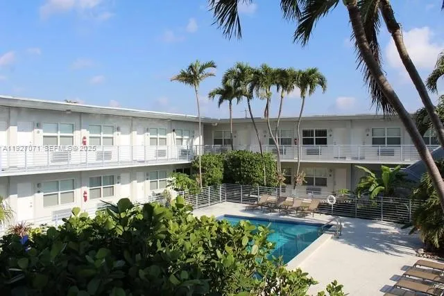 a front view of house with yard and outdoor seating