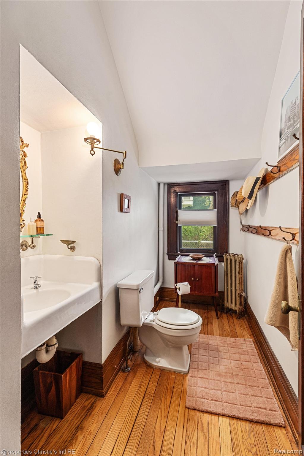 36 Longfellow Street Detroit, MI 48202 - Photo 33 of 81 Bathroom featuring lofted ceiling, light wood finished floors, and radiator
