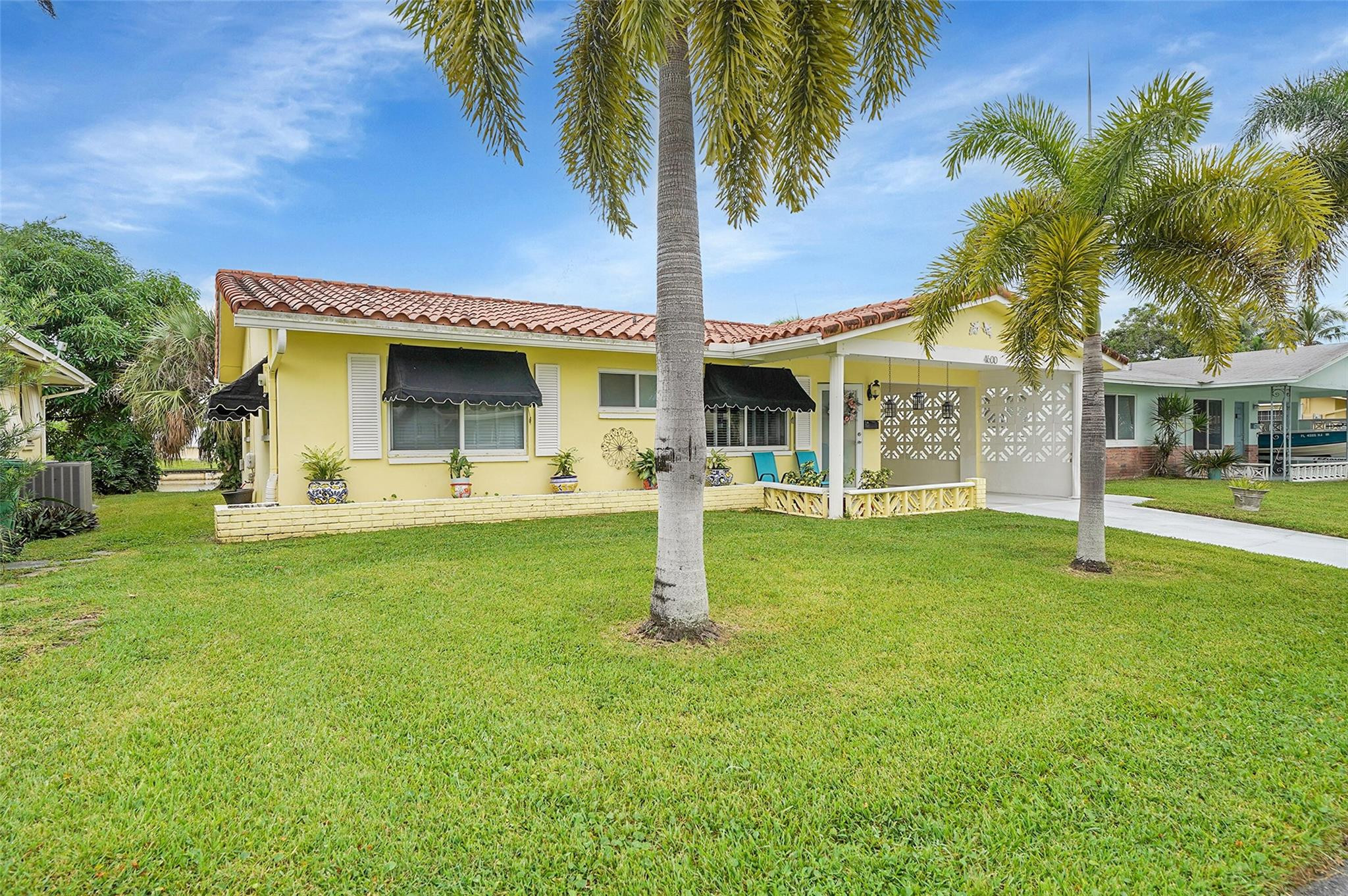 4600 Northwest 45th Street Tamarac, FL 33319 - Photo 1 of 15 Front view with carport