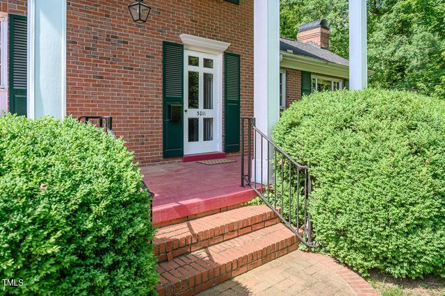 a view of a backyard with potted plants
