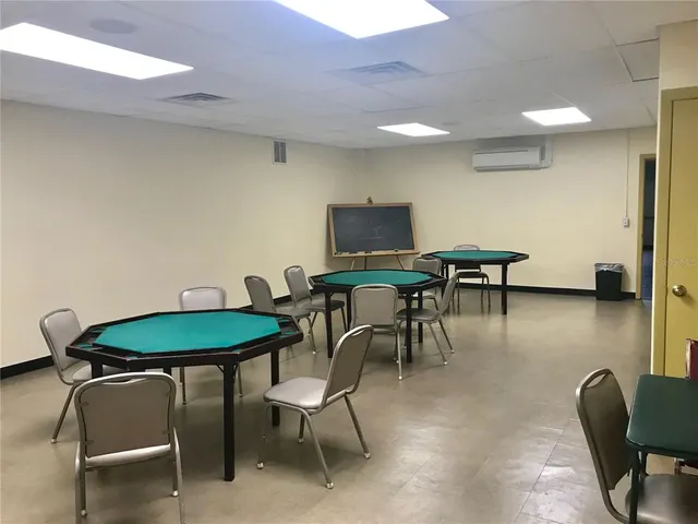 a view of a dining room with furniture and a lounge chair