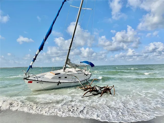 a view of a backyard with table and chairs