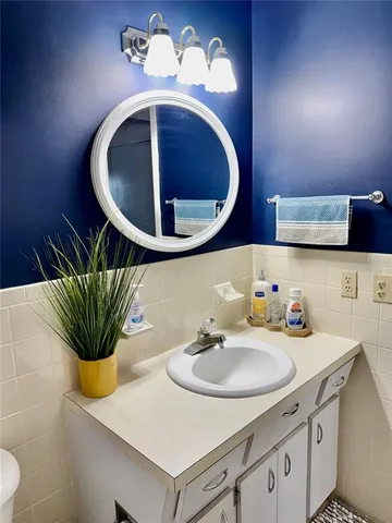 a bathroom with a sink and a mirror