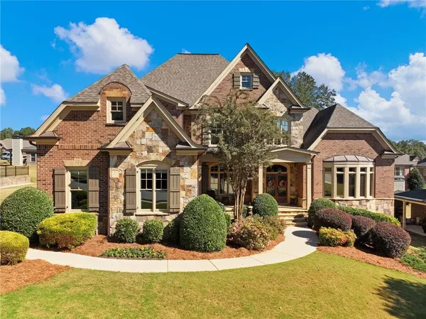 a front view of a house with a yard