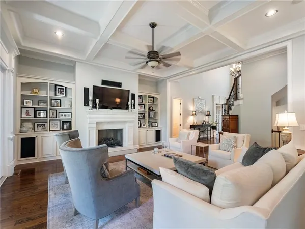 a dining room with furniture window and wooden floor