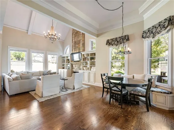 a bathroom with a granite countertop toilet a sink and a bathtub