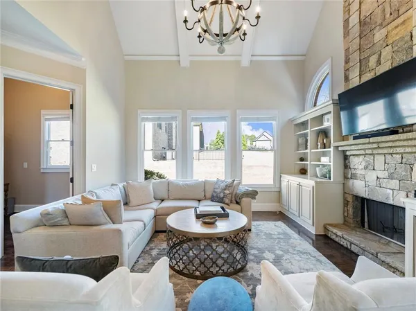 a living room with furniture and a book shelf