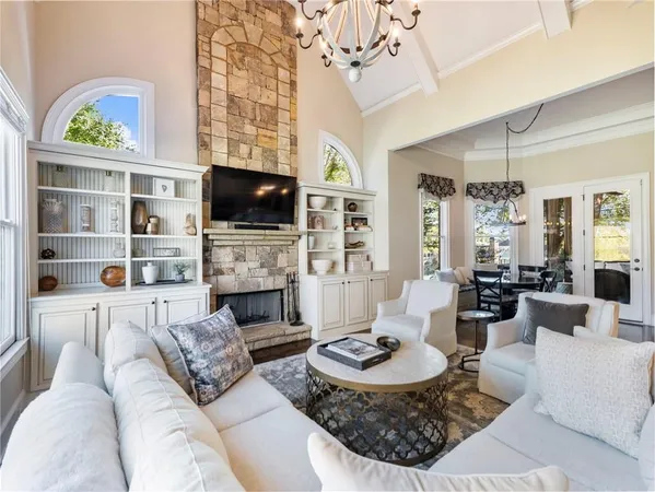 a view of a livingroom with furniture and a chandelier